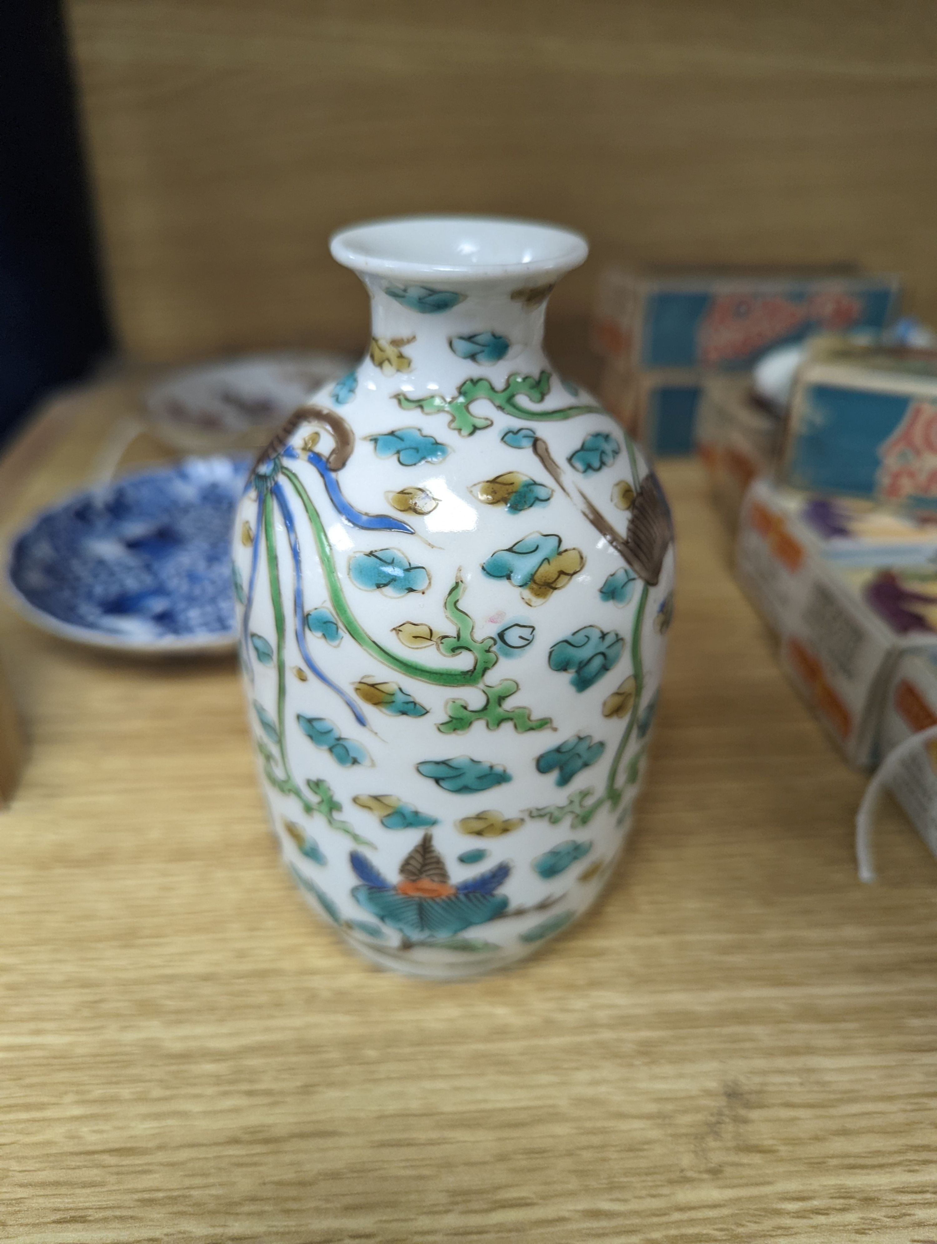 Two Chinese porcelain saucer dishes and an enamelled porcelain vase, 18th century and later, 12.5cm